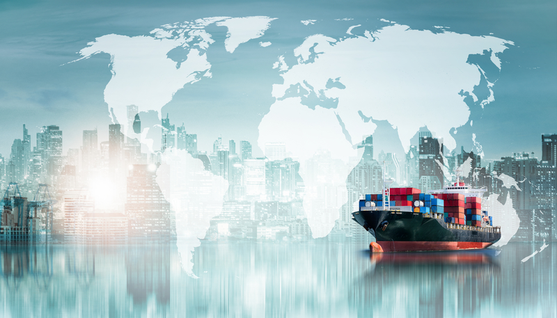 Cargo ship against big city skyline with world map overlay