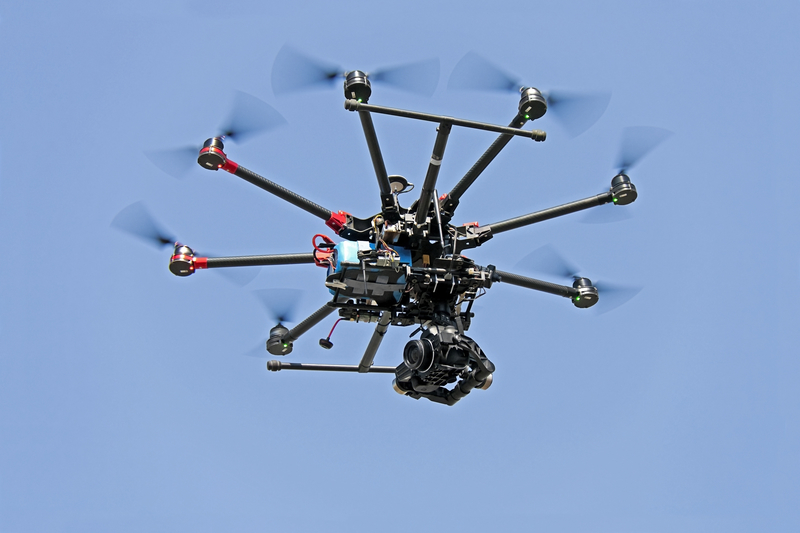 Drone flying in blue sky